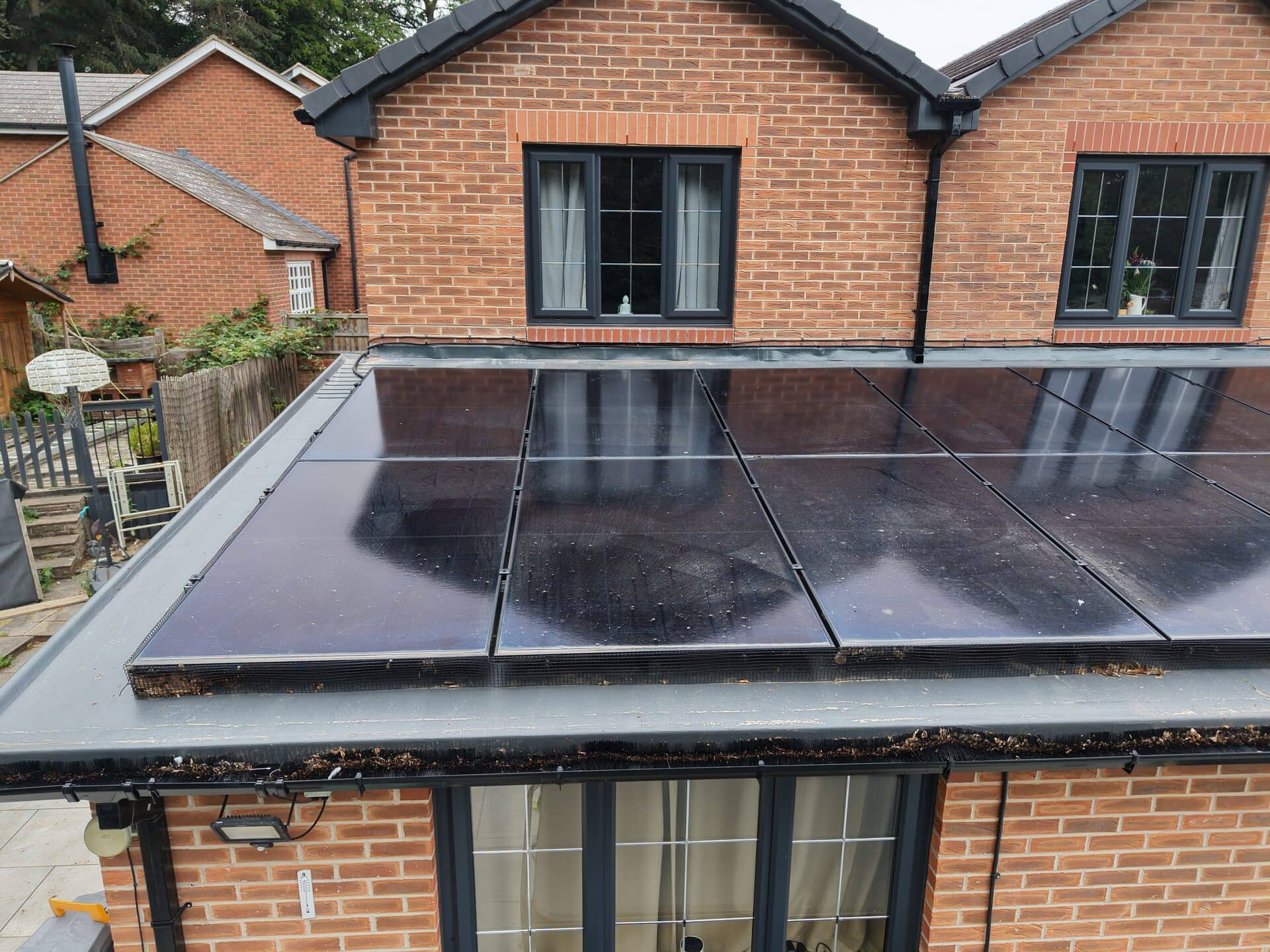 Aerial close-up of solar panels fitted to a tiled roof